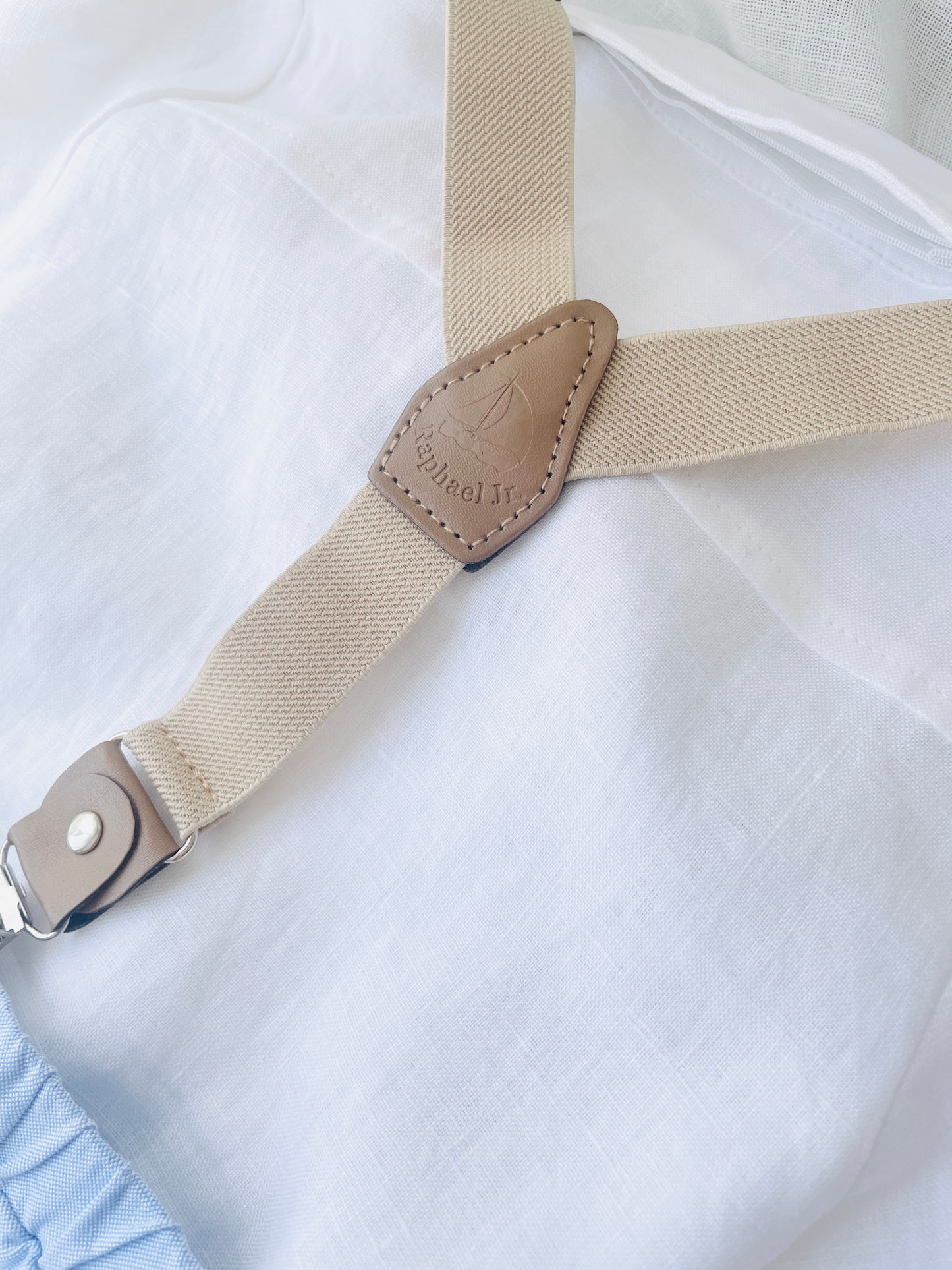 Blue chambray set with blue pants, white linen shirt, white suspenders and blue bowtie