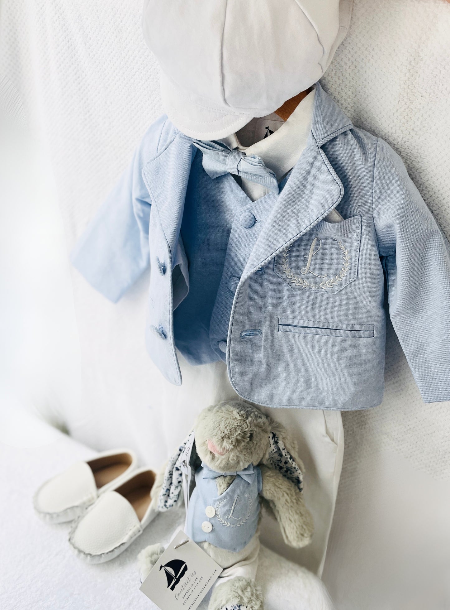 Light blue and white suit set with blue vest, bow tie and jacket, white linen pants, suspenders and shirt