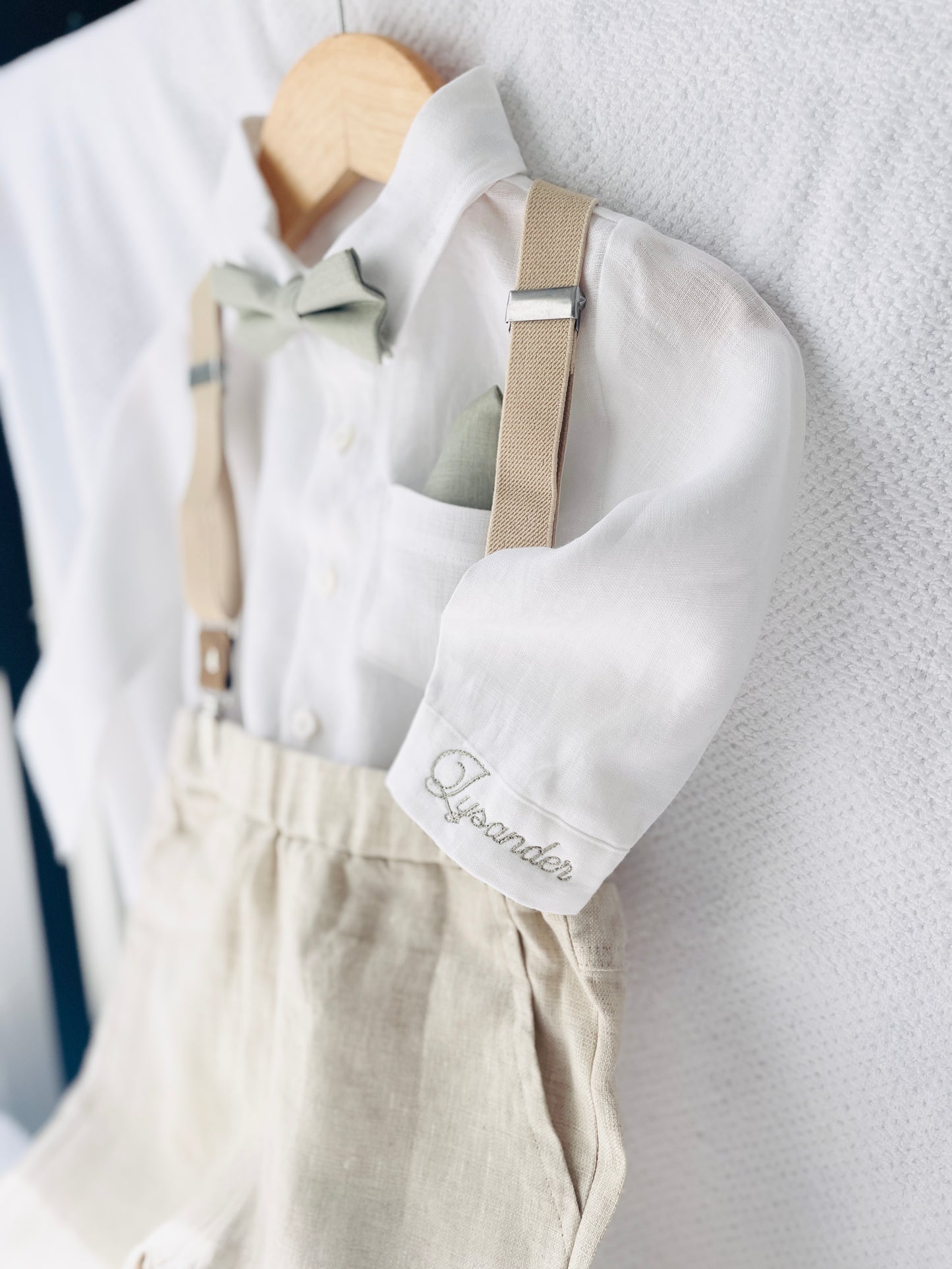 Beige linen suit with optional jacket, cap and shoes.
