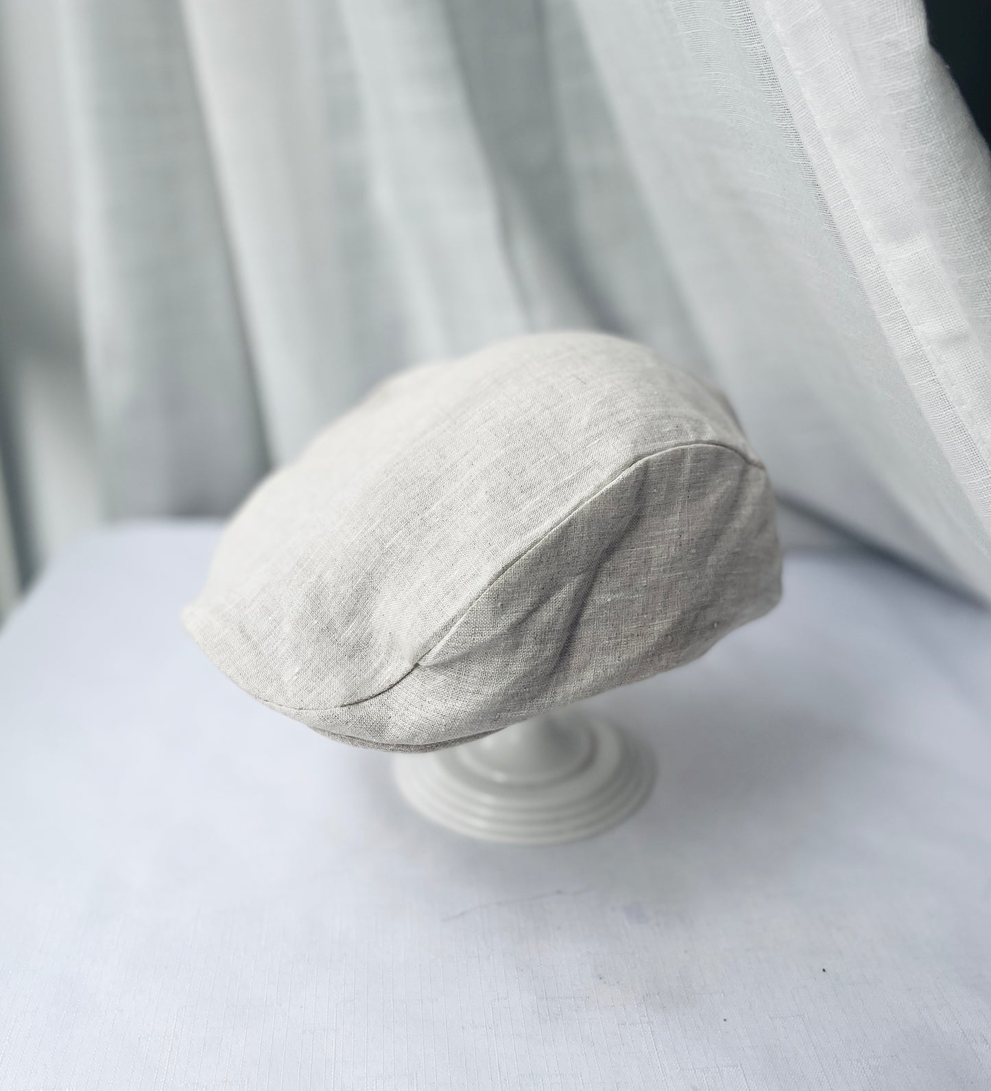 Beige linen suit with optional jacket, cap and shoes.