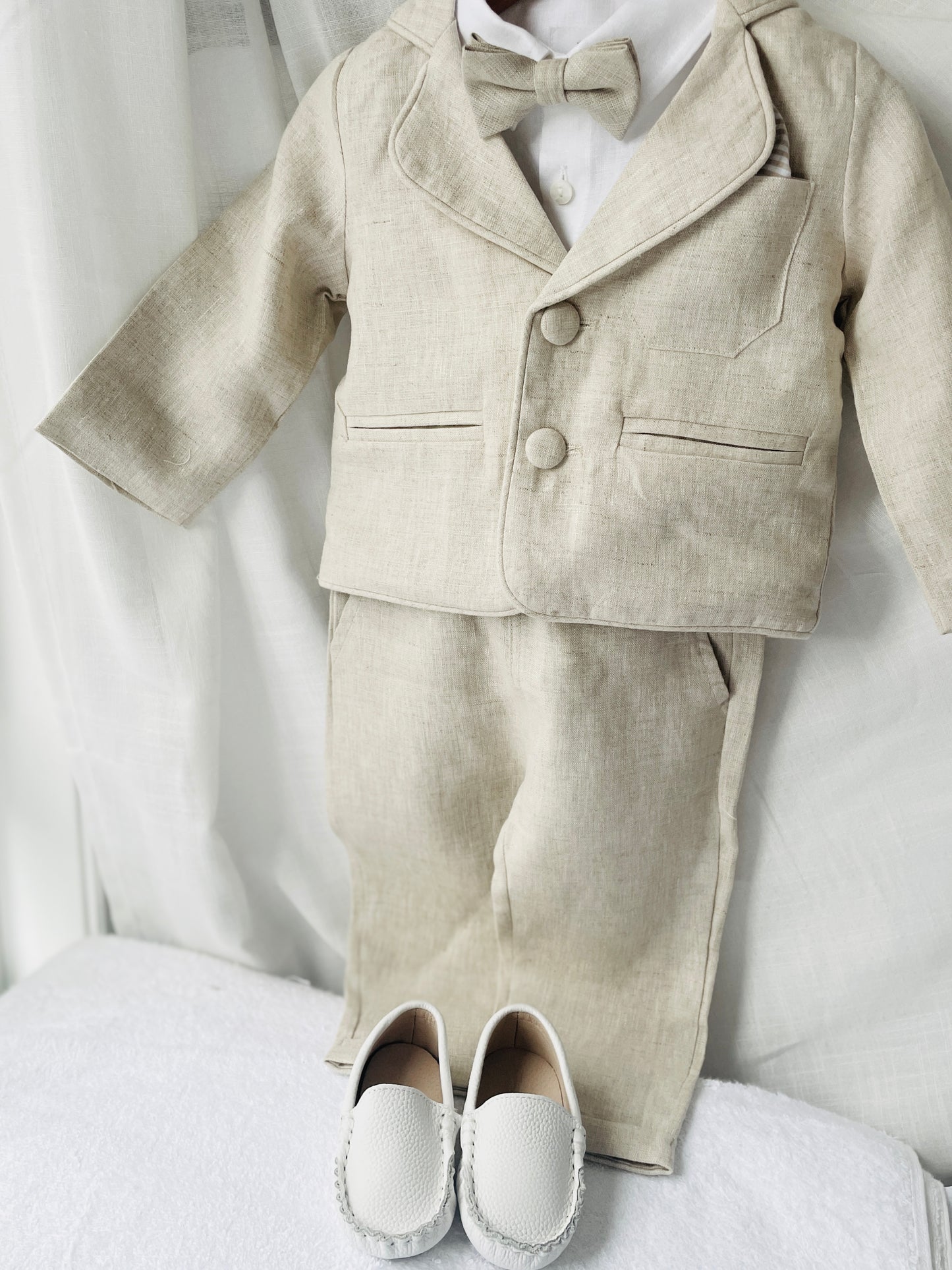 Beige linen suit with optional jacket, cap and shoes.