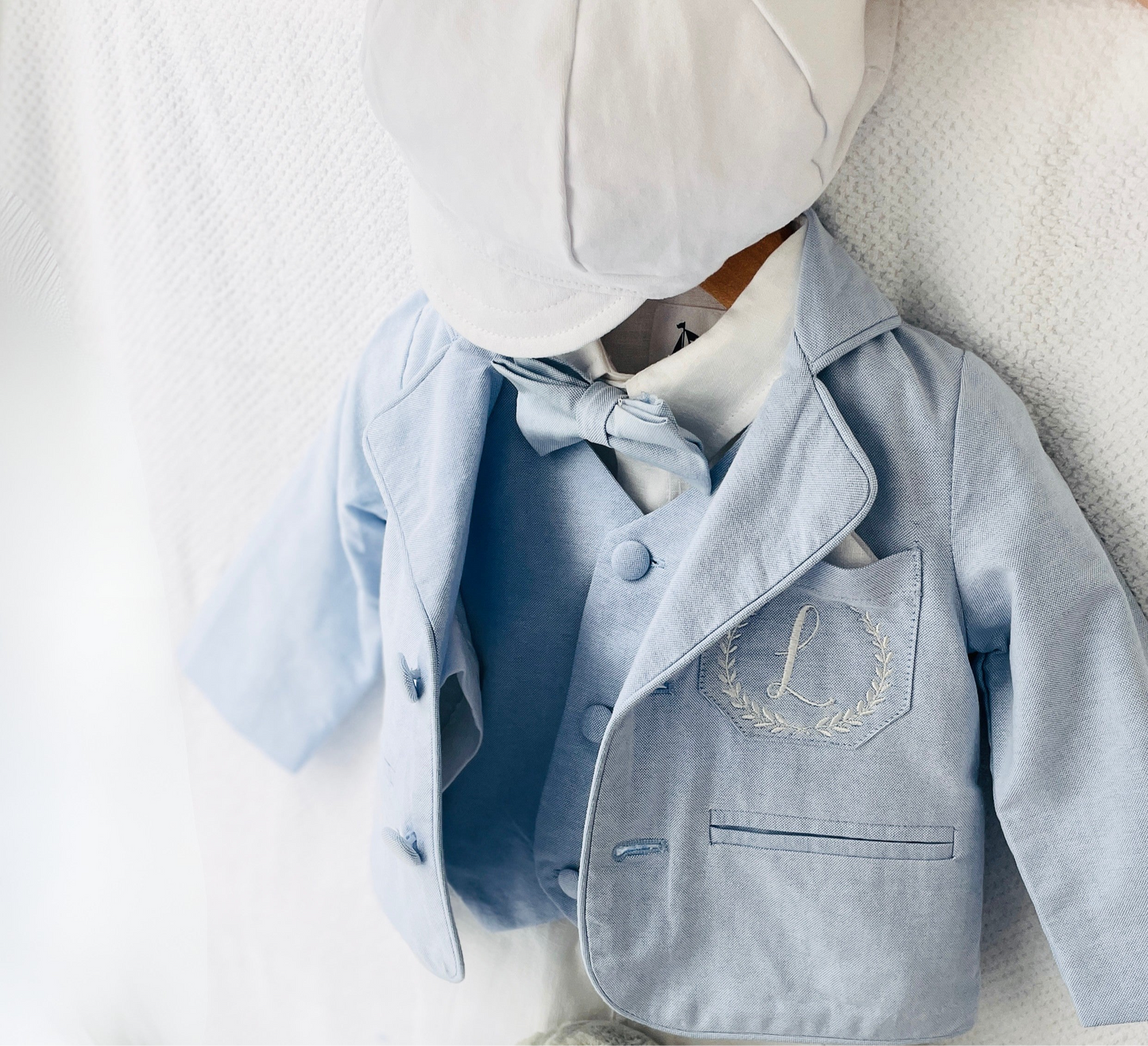 Light blue and white suit set with blue vest, bow tie and jacket, white linen pants, suspenders and shirt
