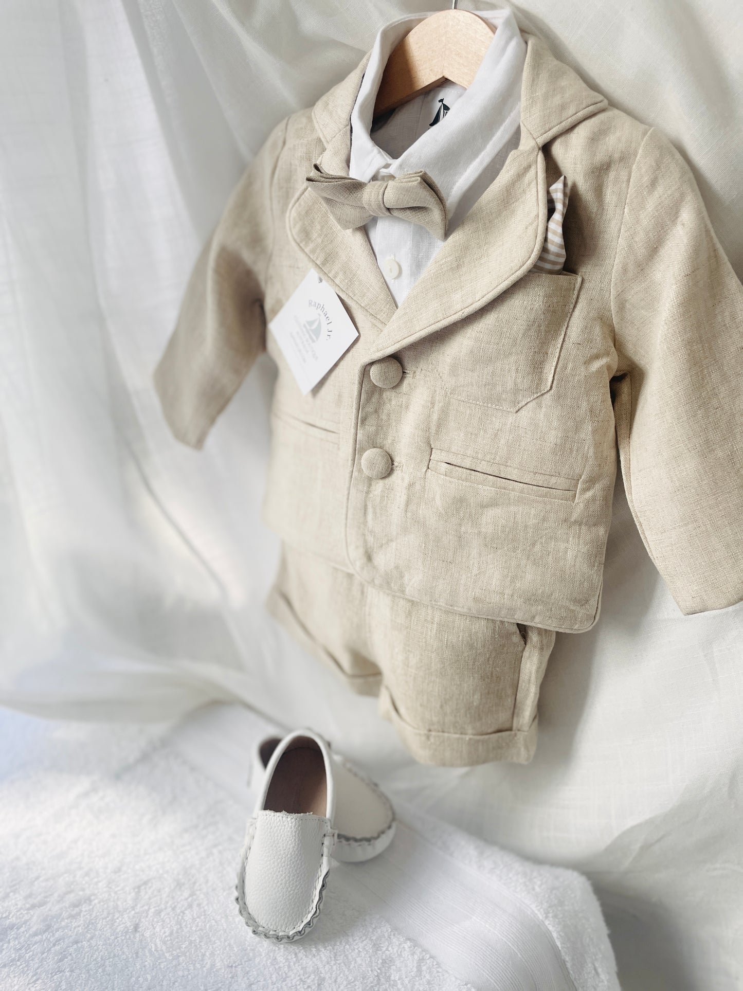 Beige linen summer set with shorts, shirt, suspenders and bow tie plus optional extras