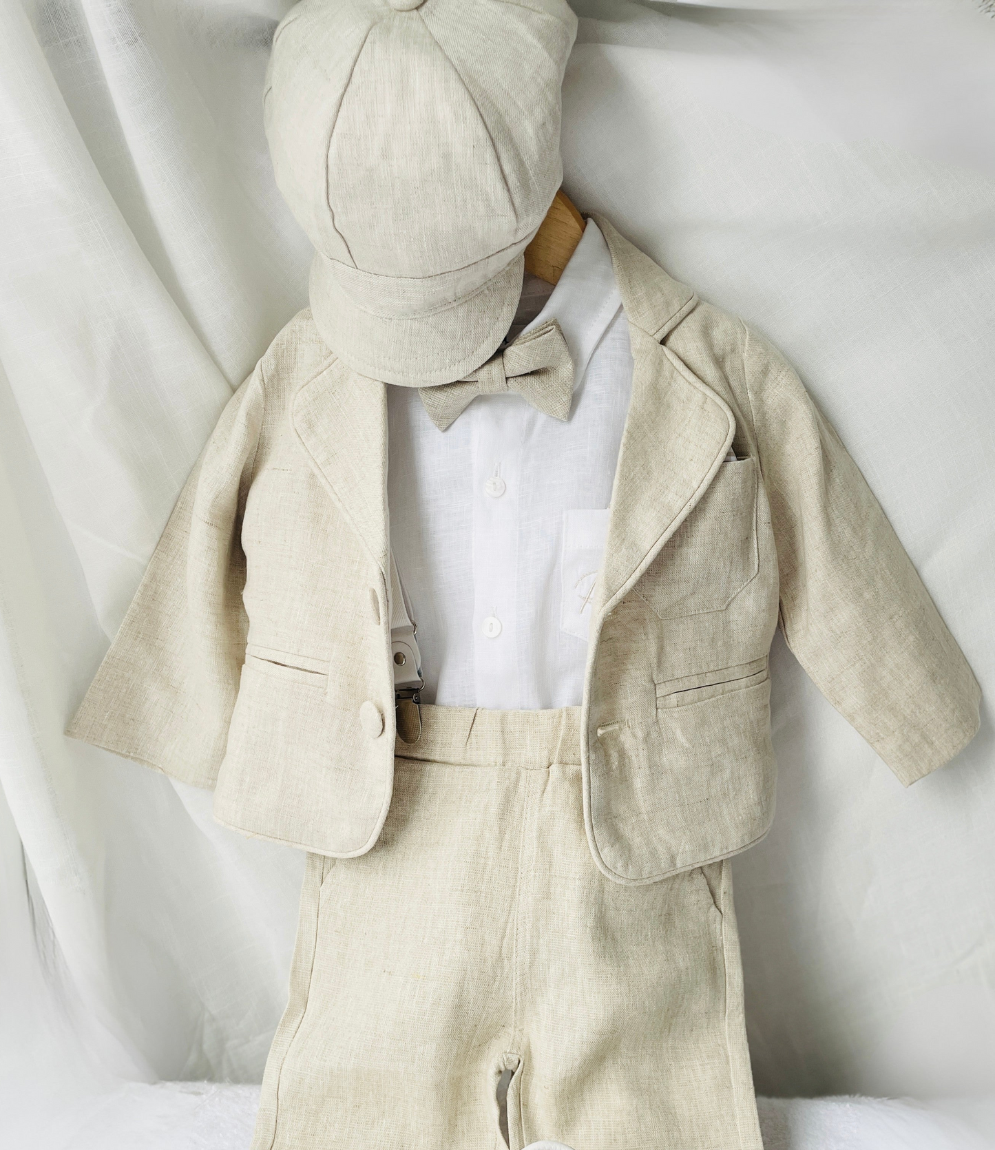 Beige linen suit with optional jacket, cap and shoes.
