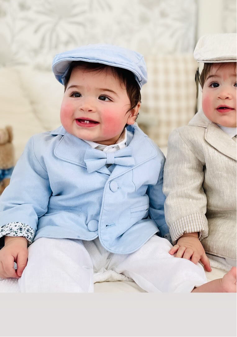 Light blue and white suit set with blue vest, bow tie and jacket, white linen pants, suspenders and shirt