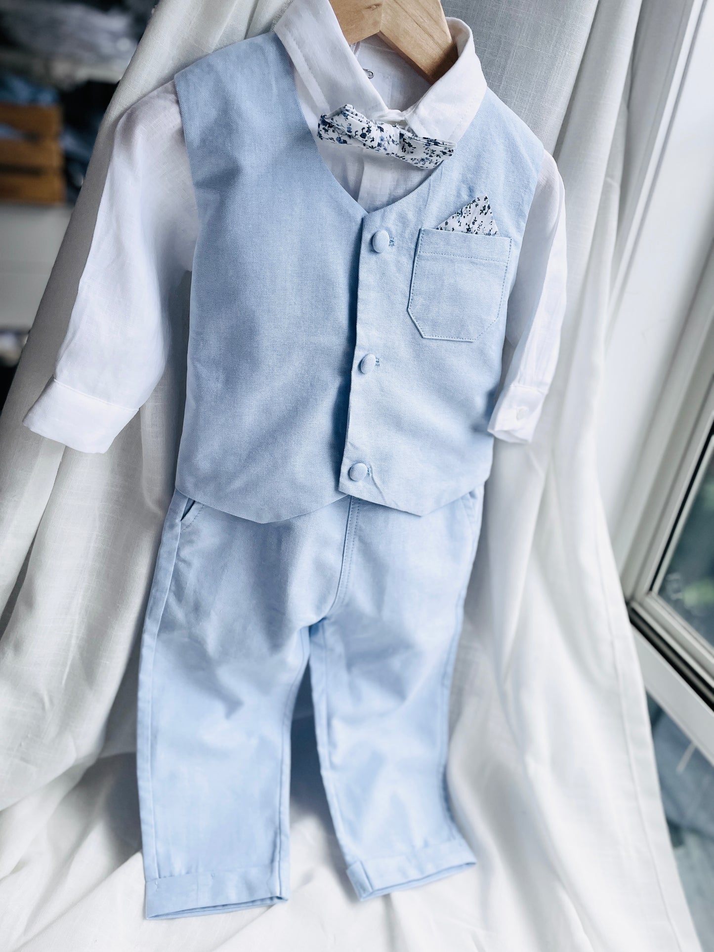 Baby and Toddler Boys pale blue chambray set with vest, pants, linen shirt, bowtie and suspenders, plus optional jacket cap and shoes