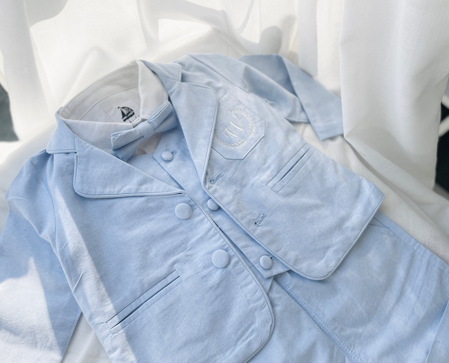 Baby and Toddler Boys pale blue chambray set with vest, pants, linen shirt, bowtie and suspenders, plus optional jacket cap and shoes