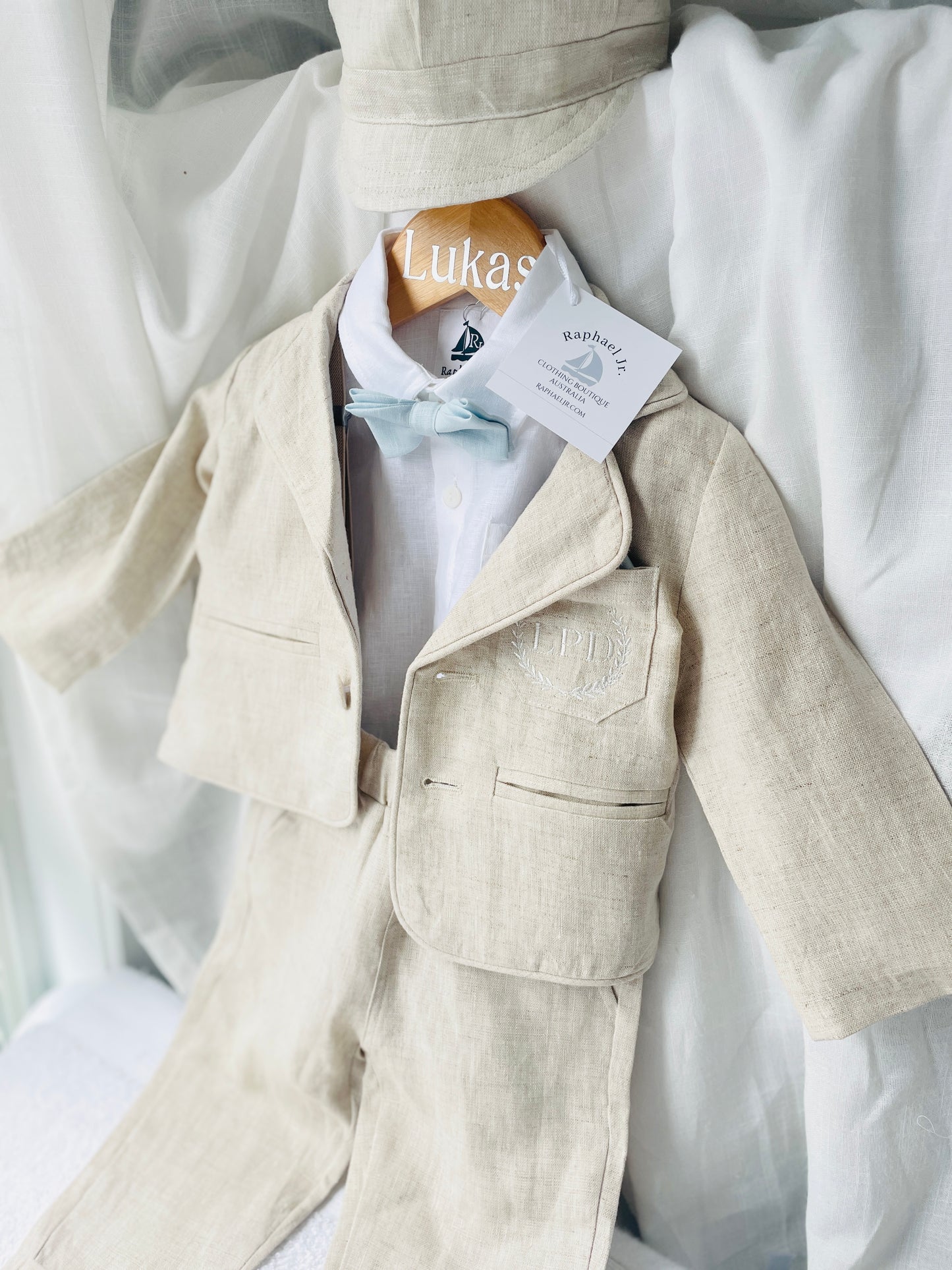 Beige linen suit with optional jacket, cap and shoes.