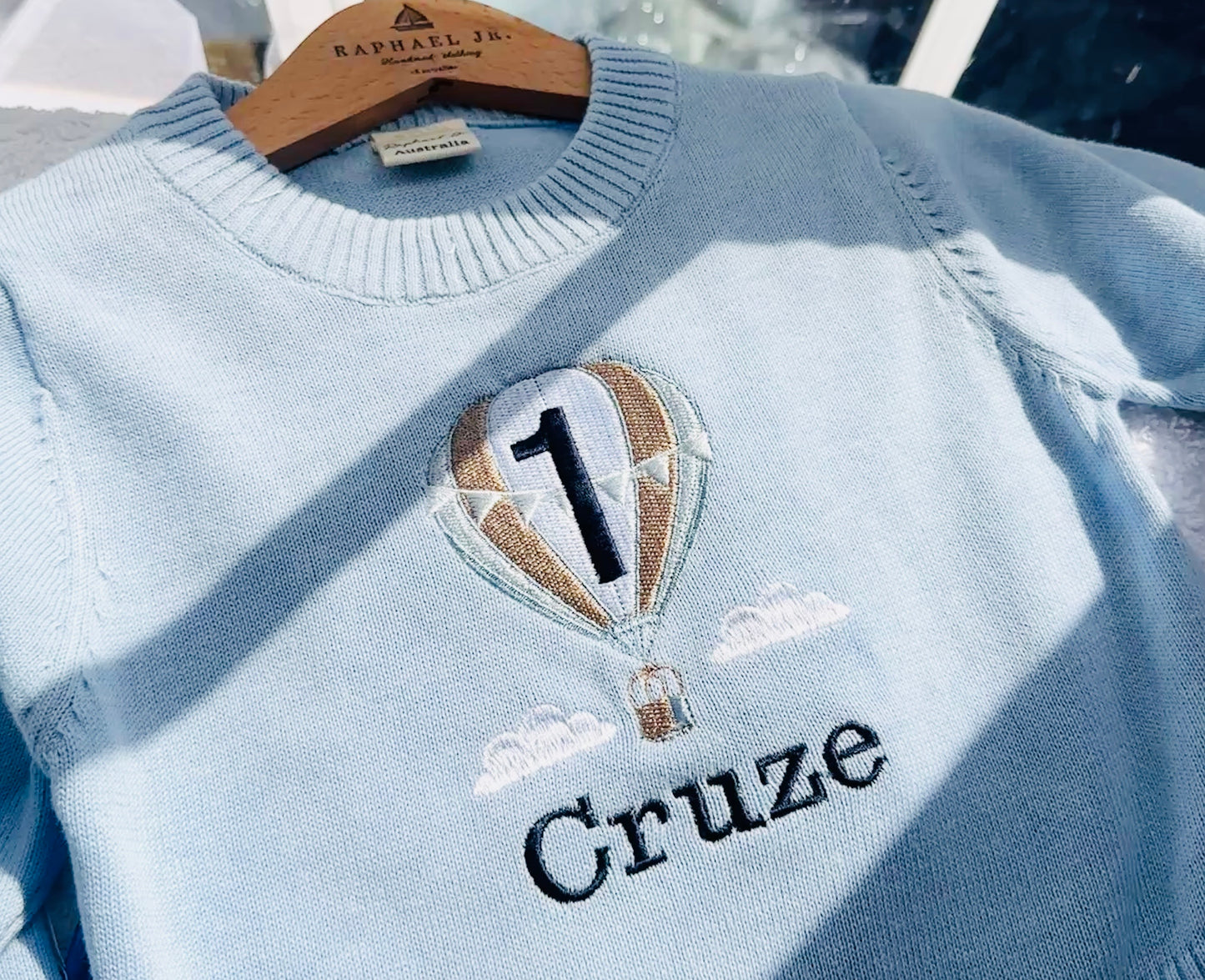 Baby blue cotton sweater with optional embroidery