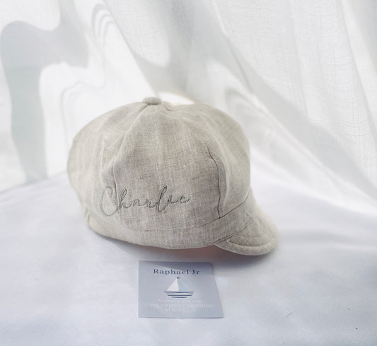 Beige linen paper boy cap for baptisms and christenings with optional embroidery