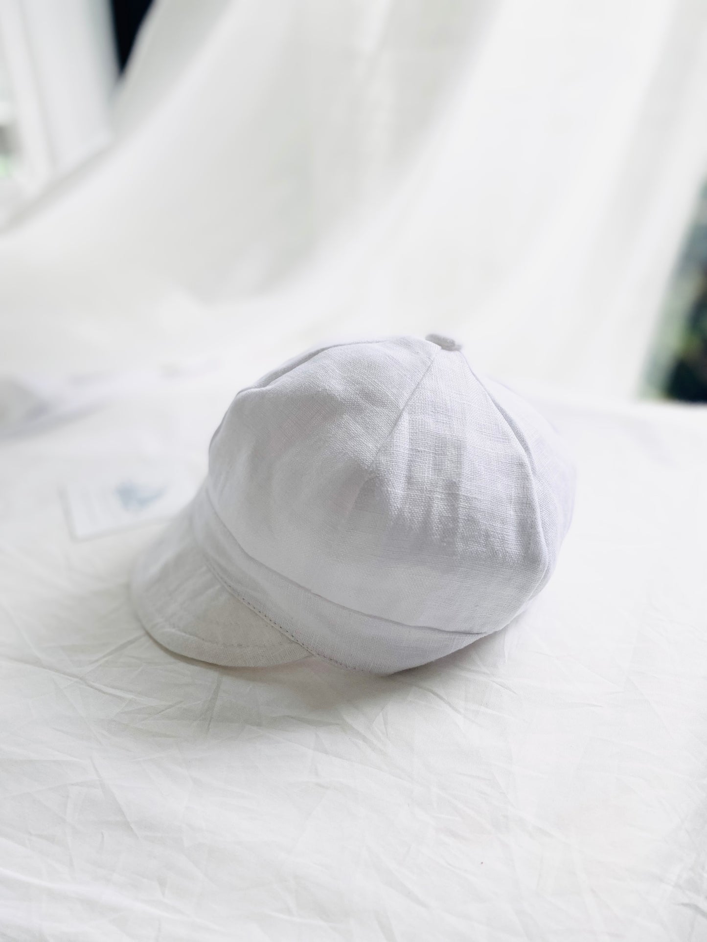 White linen baby cap for baptisms and christenings with optional embroidery
