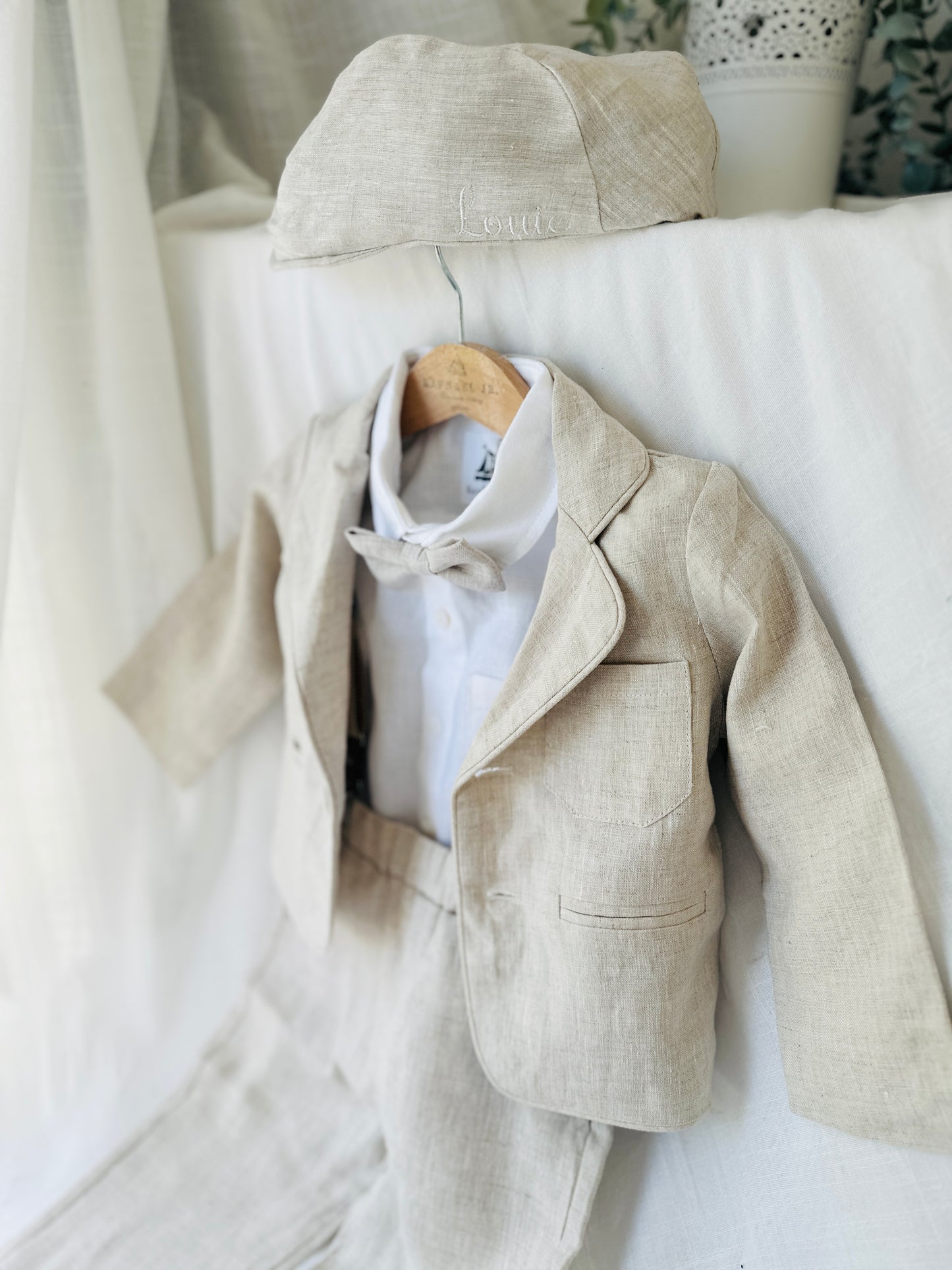 Beige linen suit with optional jacket, cap and shoes.