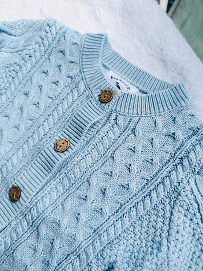 Baby outfit with blue cardigan, round collar bodysuit and white linen bloomers and long socks