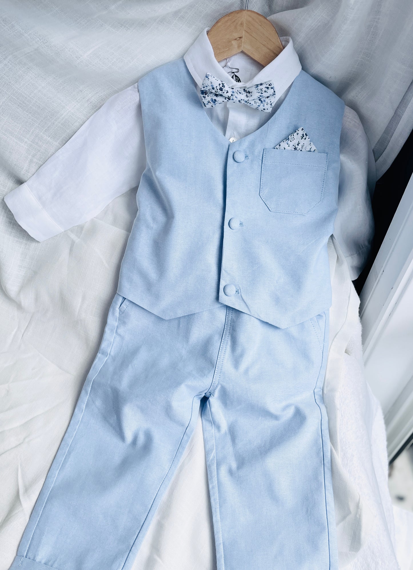 Baby and Toddler Boys pale blue chambray set with vest, pants, linen shirt, bowtie and suspenders, plus optional jacket cap and shoes