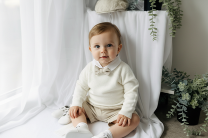 Beige Linen outfit with shorts, socks, shirt, and bow tie plus sweater