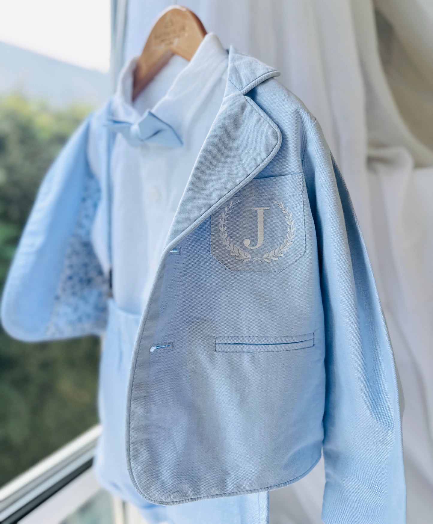 Boys pale blue shorts with linen shirt, blue suspenders and bow tie outfit plus optional extras