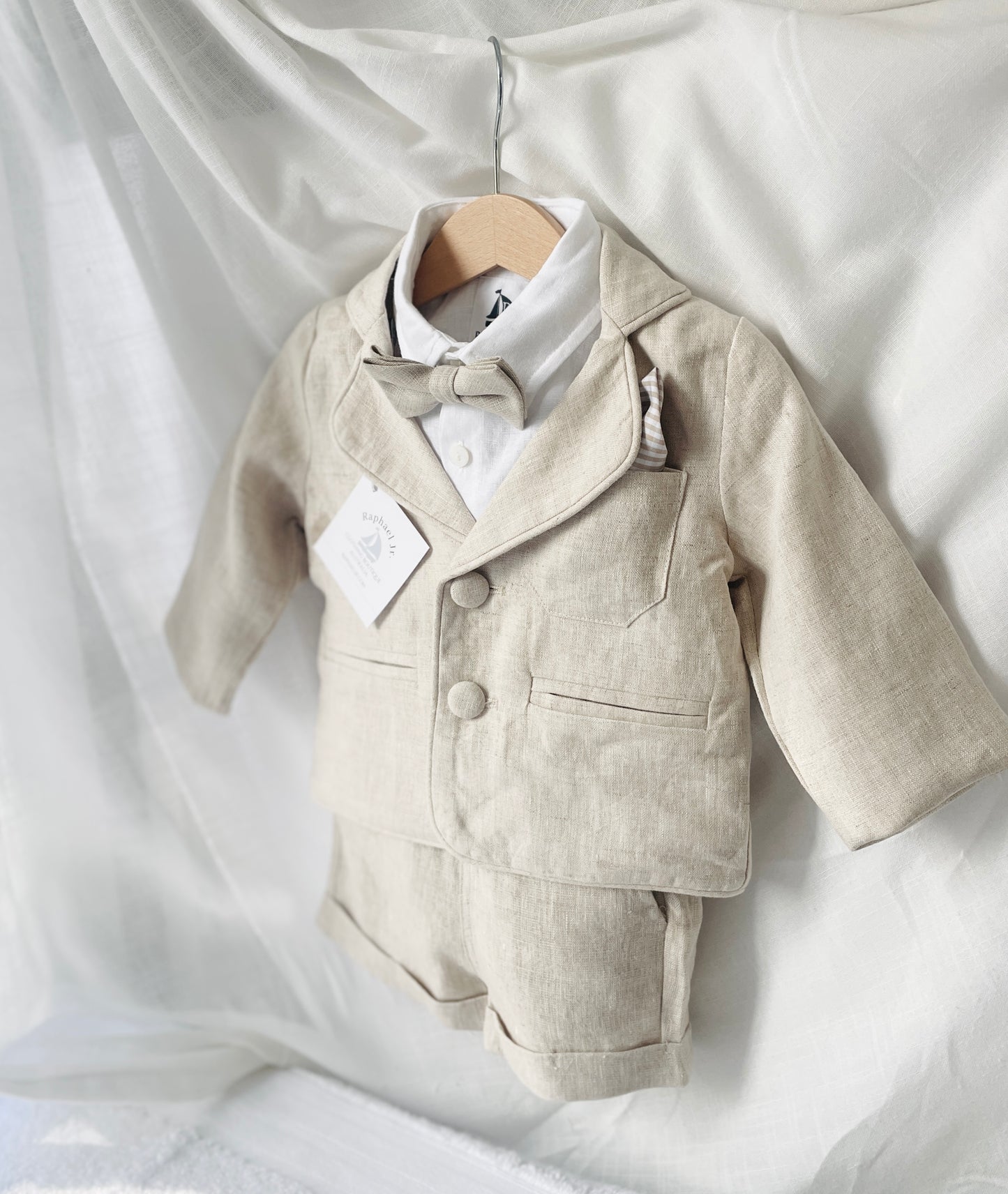 Beige linen summer set with shorts, shirt, suspenders and bow tie plus optional extras