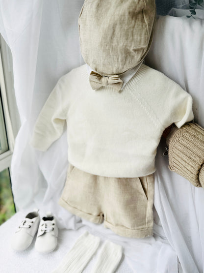 Beige Linen outfit with shorts, socks, shirt, and bow tie plus sweater