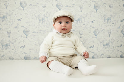 Beige Linen outfit with shorts, socks, shirt, and bow tie plus sweater
