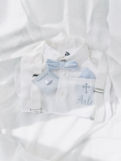 Embroidered white linen shirt with white suspenders and blue and white striped bowtie and pocket square by Raphael Jr 