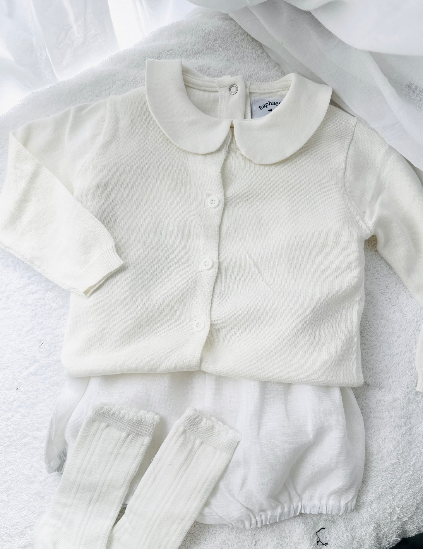 Baptism outfit with cotton onesie and cardigan or jumper and beige linen bloomers and white socks
