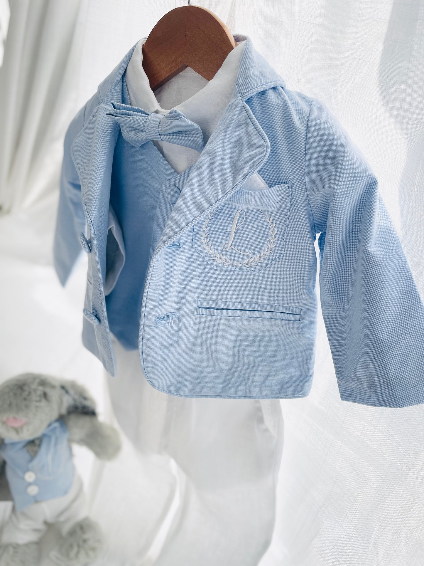 Light blue and white suit set with blue vest, bow tie and jacket, white linen pants, suspenders and shirt
