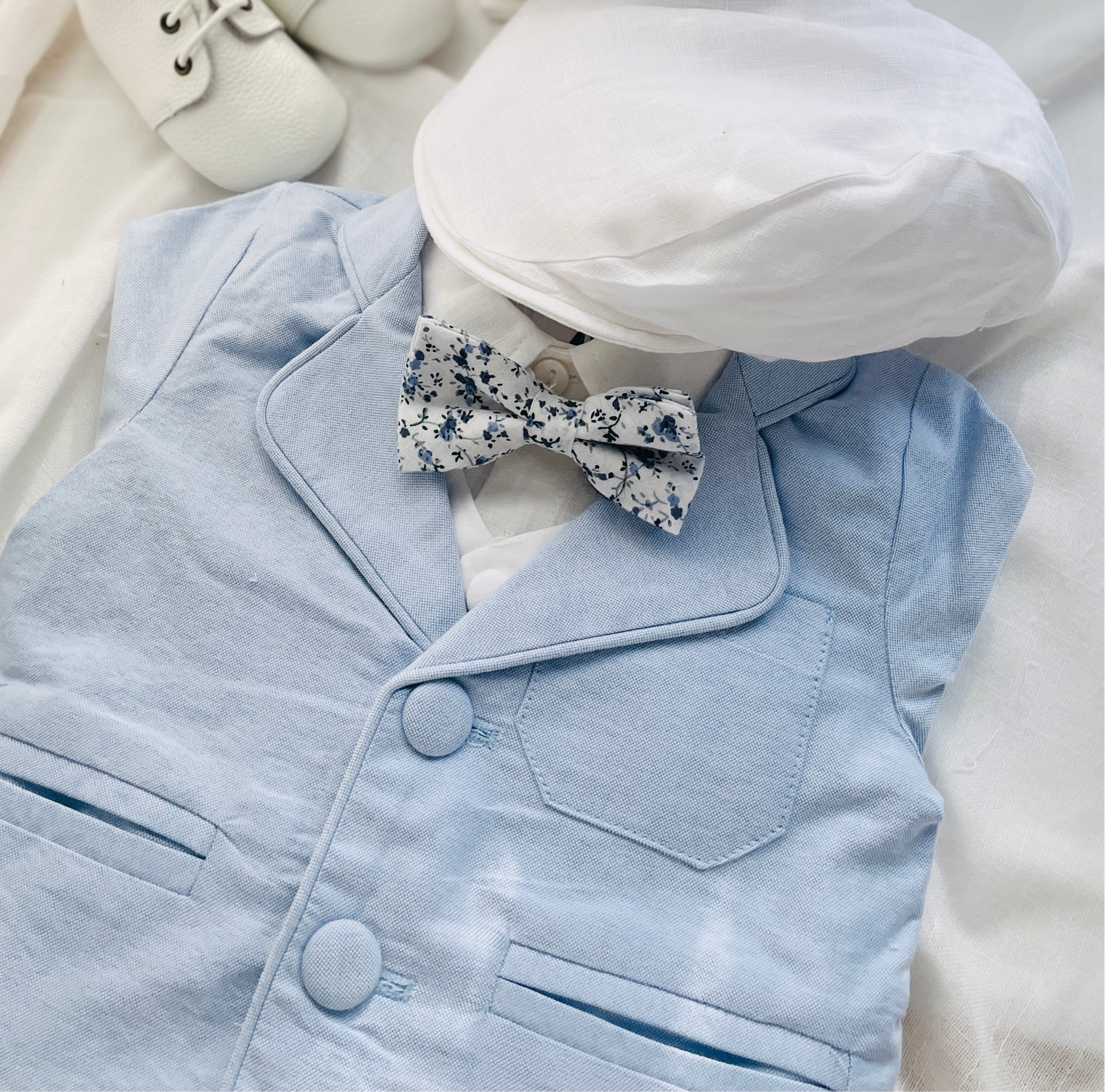 Baby and Toddler Boys pale blue chambray set with vest, pants, linen shirt, bowtie and suspenders, plus optional jacket cap and shoes