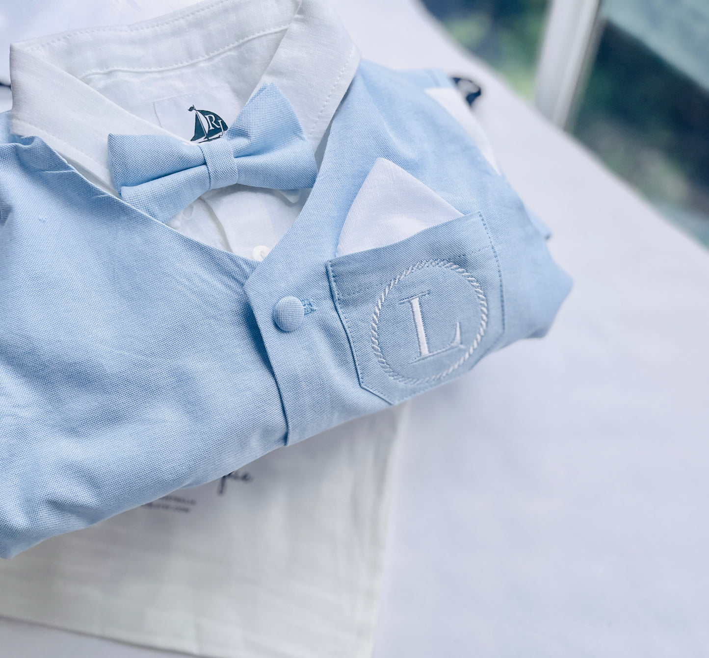 Baby and Toddler Boys pale blue chambray set with vest, pants, linen shirt, bowtie and suspenders, plus optional jacket cap and shoes