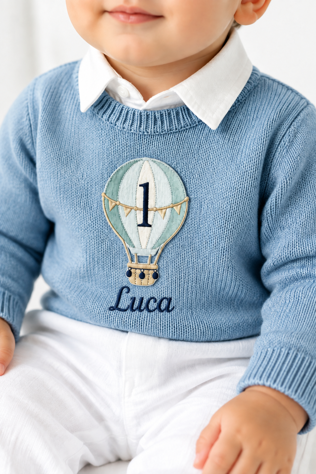 Pale blue teddy or hot air balloon jumper knit