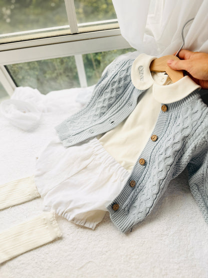 Baby outfit with blue cardigan, round collar bodysuit and white linen bloomers and long socks