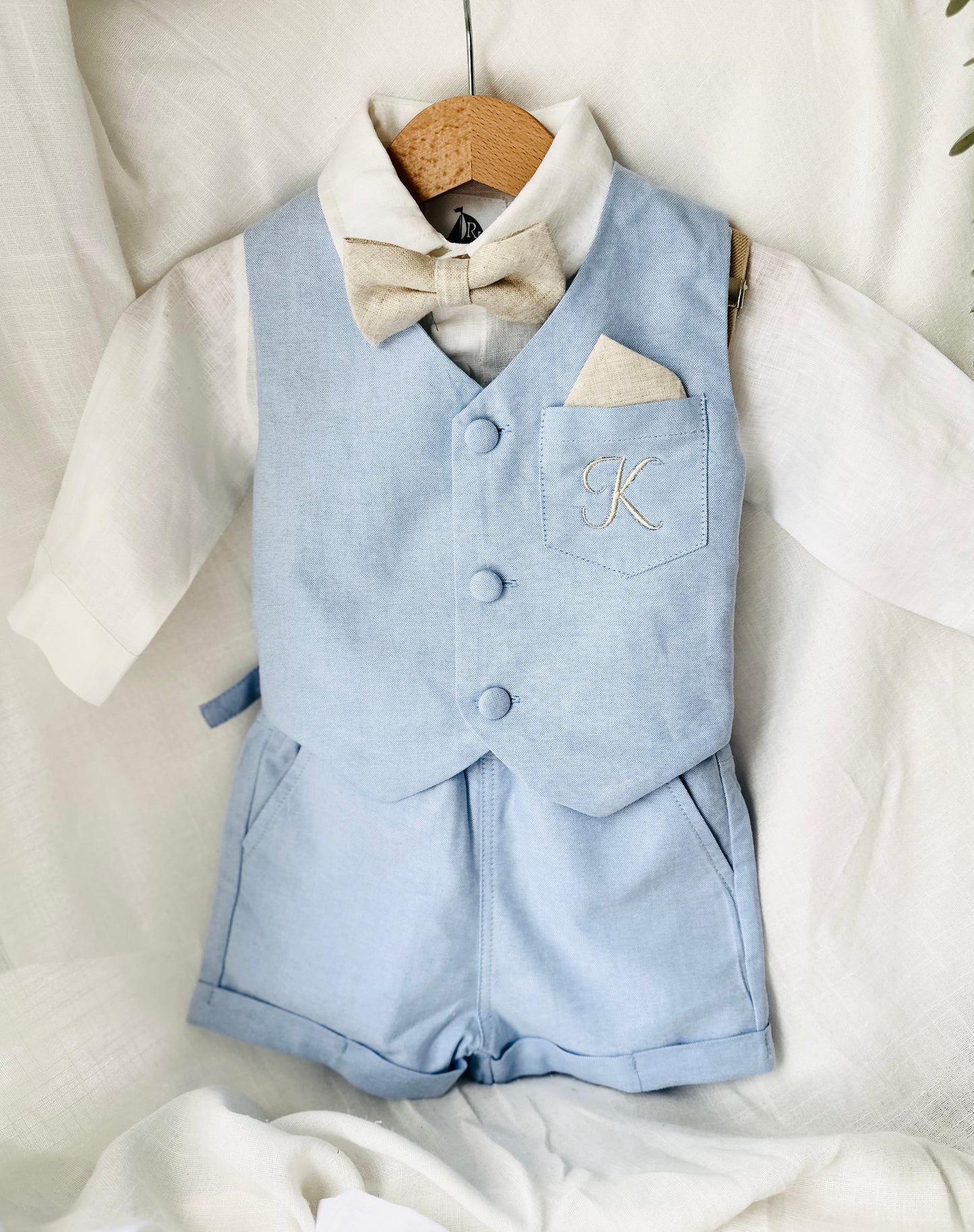 Pale blue summer vest set with blue vest, suspender shorts white shirt and bowtie