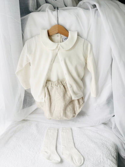 Baptism outfit with cotton onesie and cardigan or jumper and beige linen bloomers and white socks