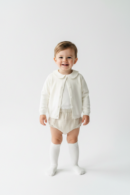 Baptism outfit with cotton onesie and cardigan or jumper and beige linen bloomers and white socks