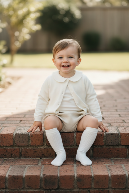 Baptism outfit with cotton onesie and cardigan or jumper and beige linen bloomers and white socks