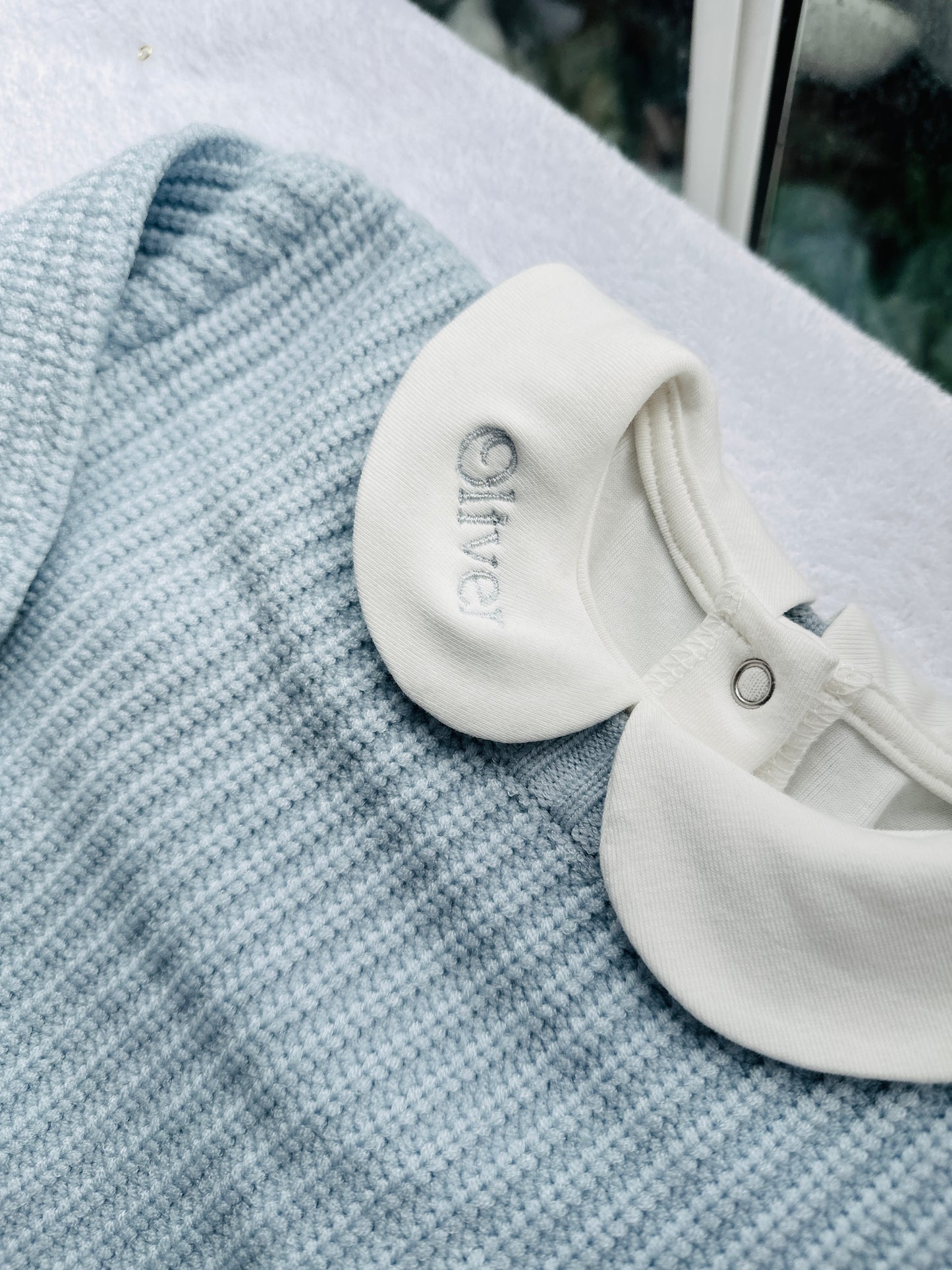 Baptism outfit with blue jumper, off white onesie and white linen bloomers and long socks
