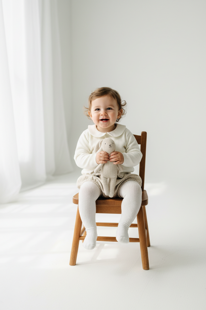 Baptism outfit with cotton onesie and cardigan or jumper and beige linen bloomers and white socks