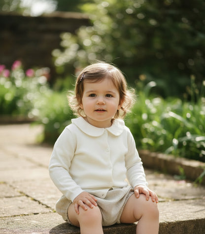 Baptism outfit with cotton onesie and cardigan or jumper and beige linen bloomers and white socks