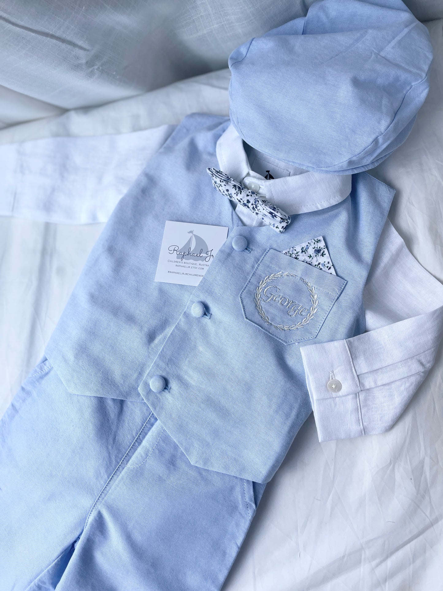 Baby and Toddler Boys pale blue chambray set with vest, pants, linen shirt, bowtie and suspenders, plus optional jacket cap and shoes