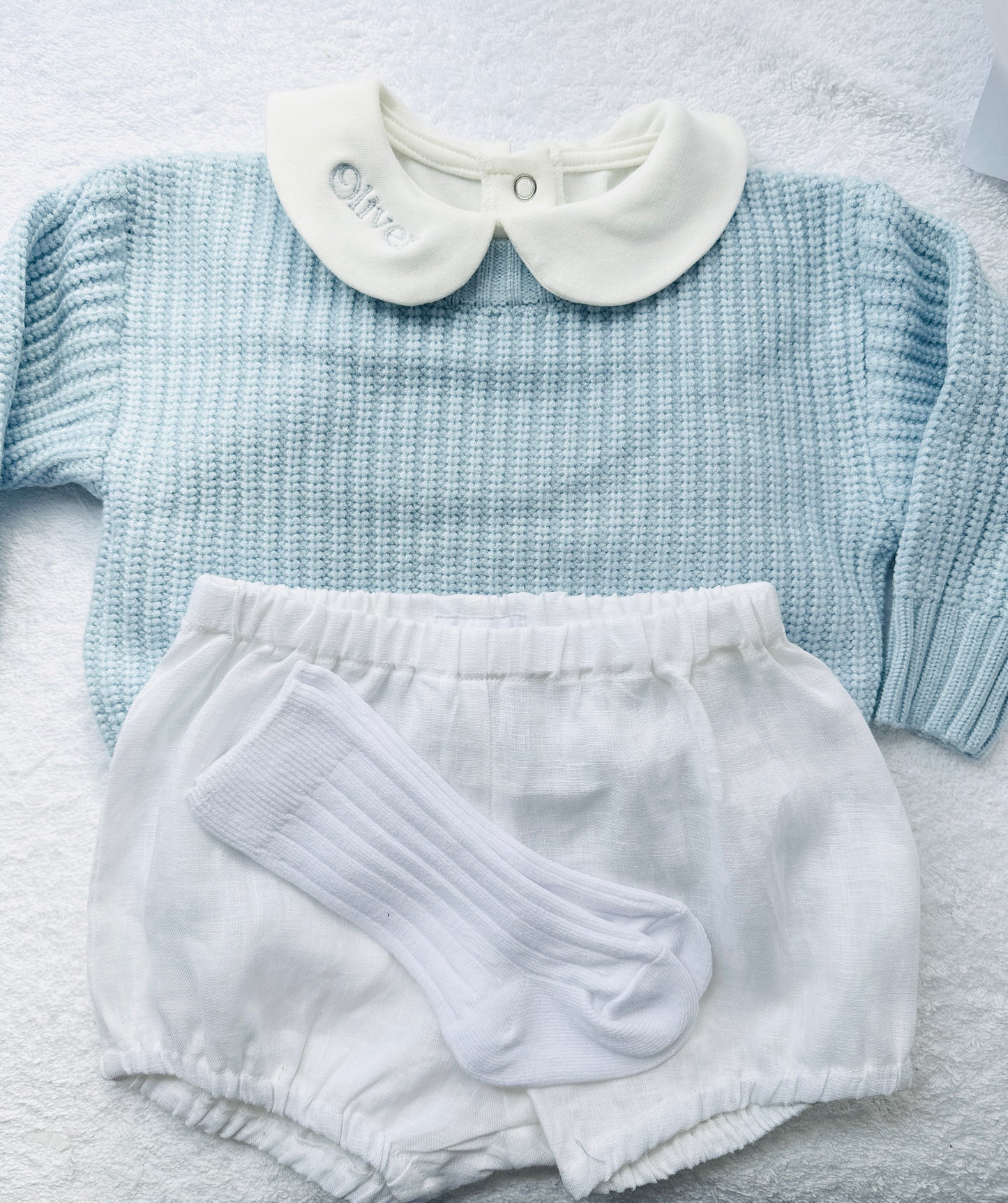 Baptism outfit with blue jumper, off white onesie and white linen bloomers and long socks