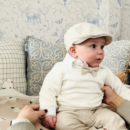 Beige Linen outfit with shorts, socks, shirt, and bow tie plus sweater