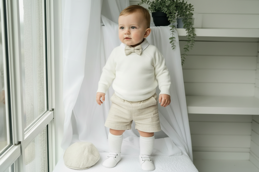Beige Linen outfit with shorts, socks, shirt, and bow tie plus sweater
