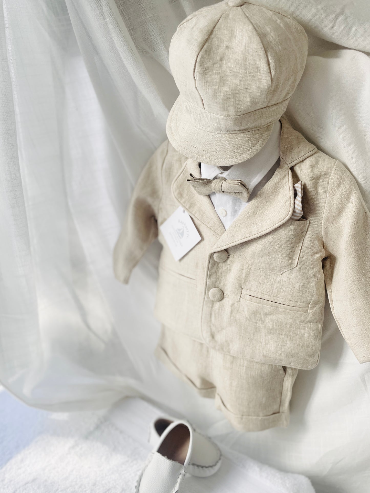 Beige linen summer set with shorts, shirt, suspenders and bow tie plus optional extras