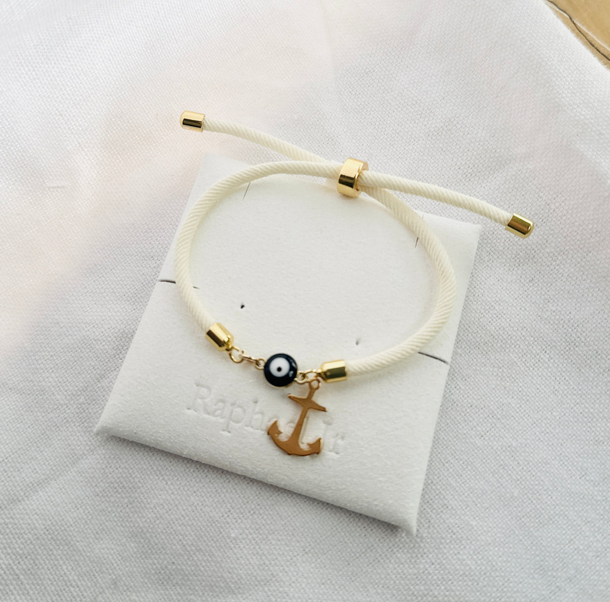Evil eye bracelet white rope with gold clasps and optional charm