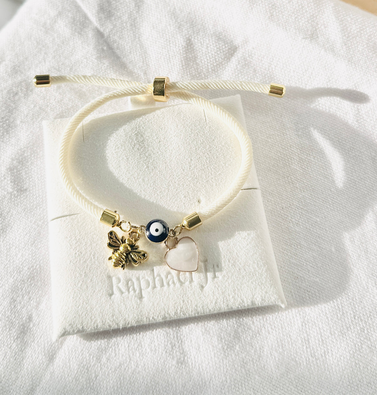 Evil eye bracelet white rope with gold clasps and optional charm