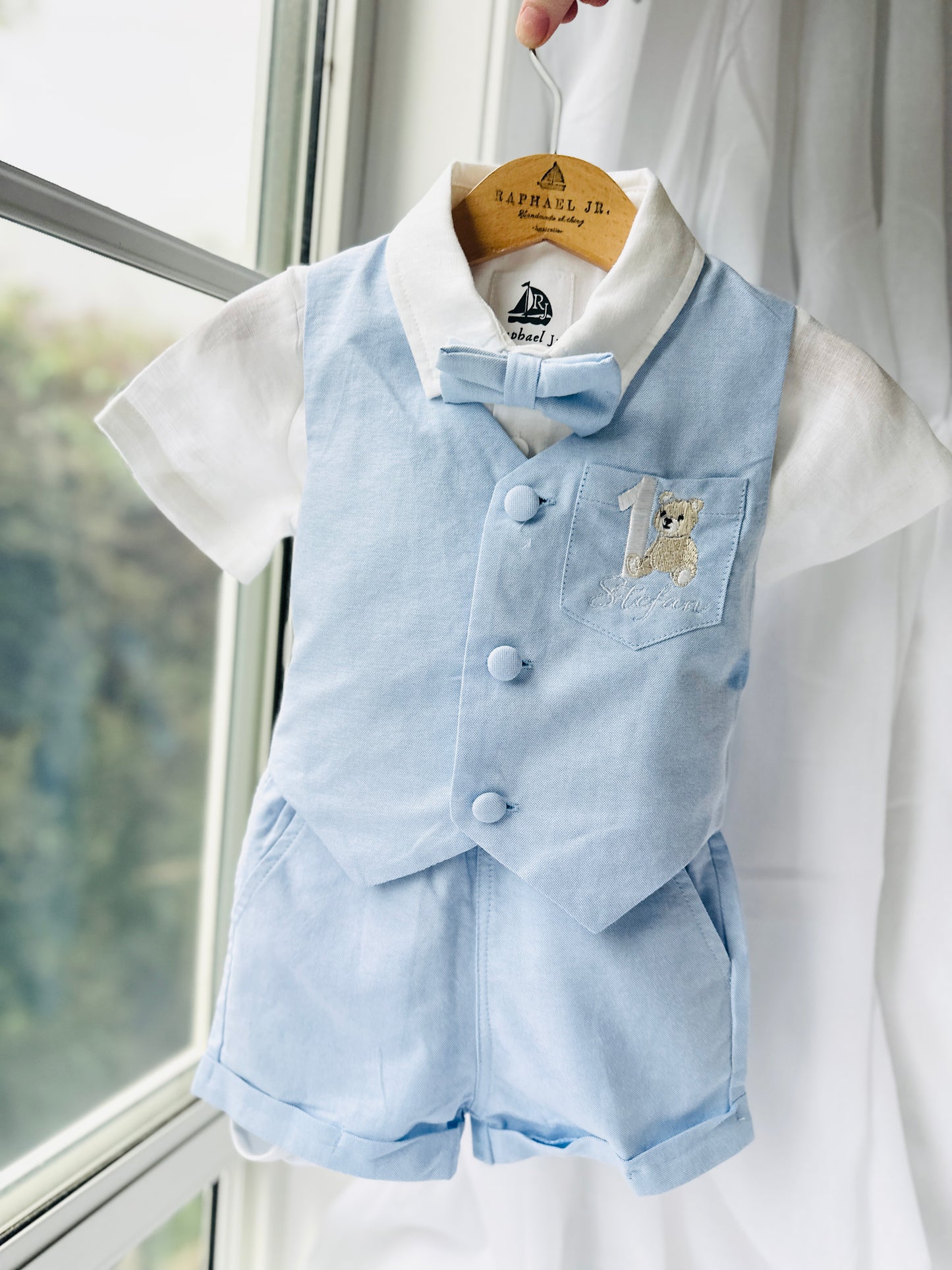 Pale blue summer vest set with blue vest, suspender shorts white shirt and bowtie