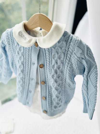 Baby outfit with blue cardigan, round collar bodysuit and white linen bloomers and long socks
