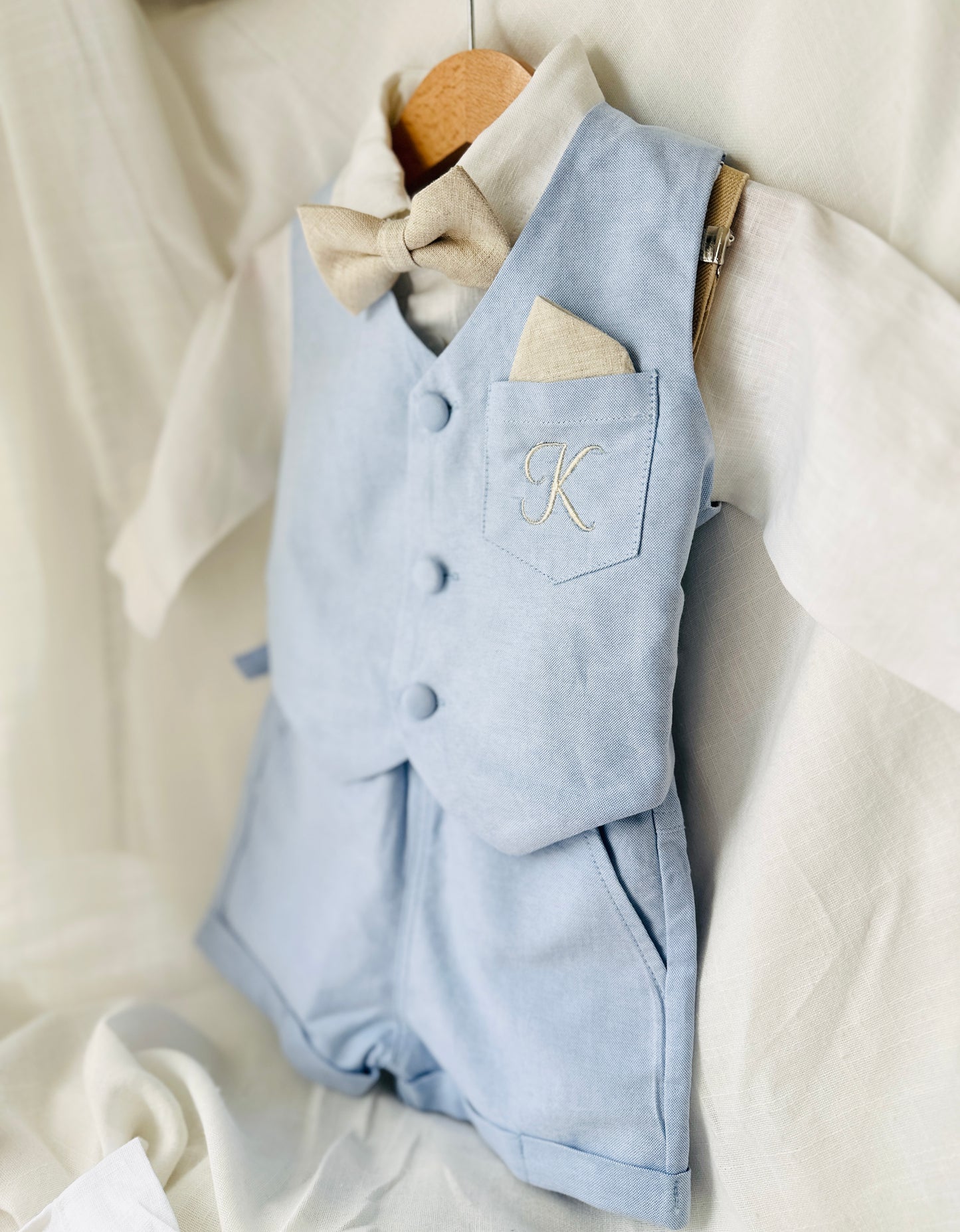 Pale blue summer vest set with blue vest, suspender shorts white shirt and bowtie