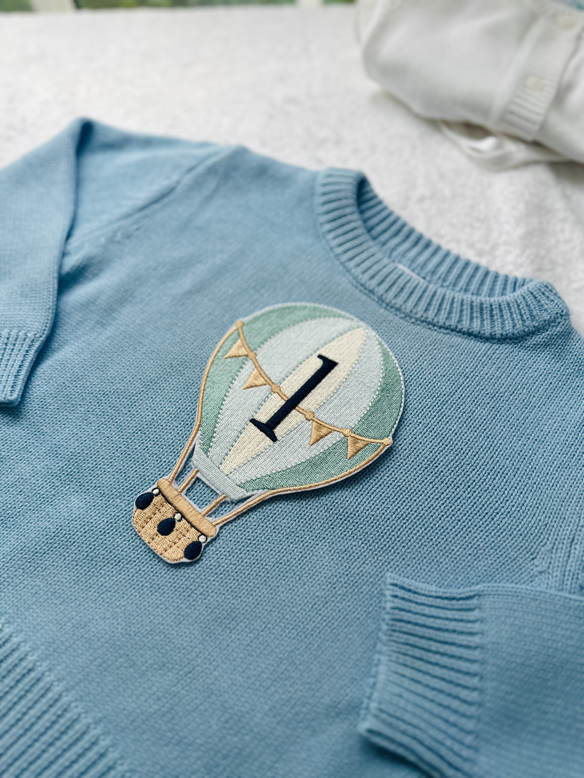 Pale blue teddy or hot air balloon jumper knit