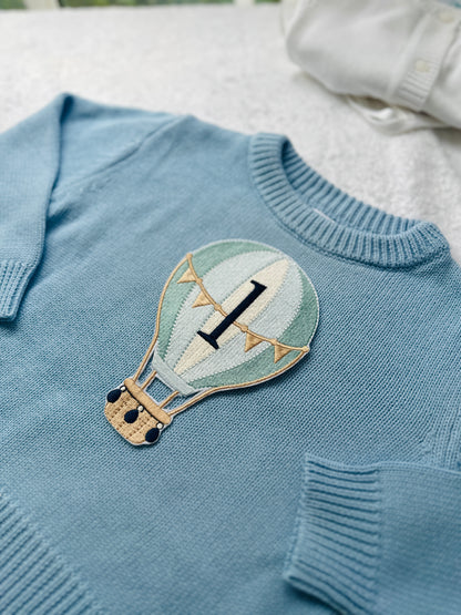 Pale blue teddy or hot air balloon jumper knit