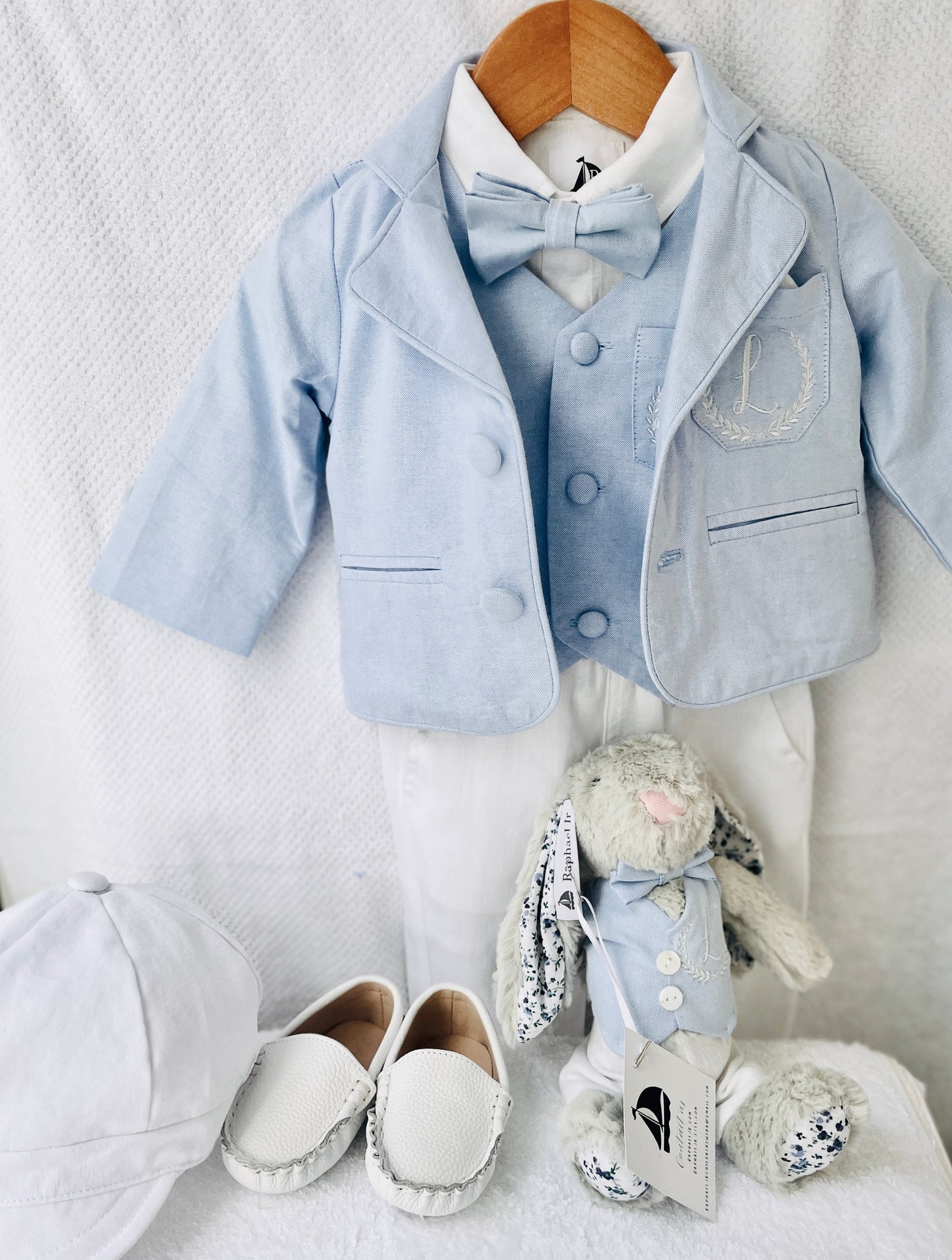 Light blue and white suit set with blue vest, bow tie and jacket, white linen pants, suspenders and shirt